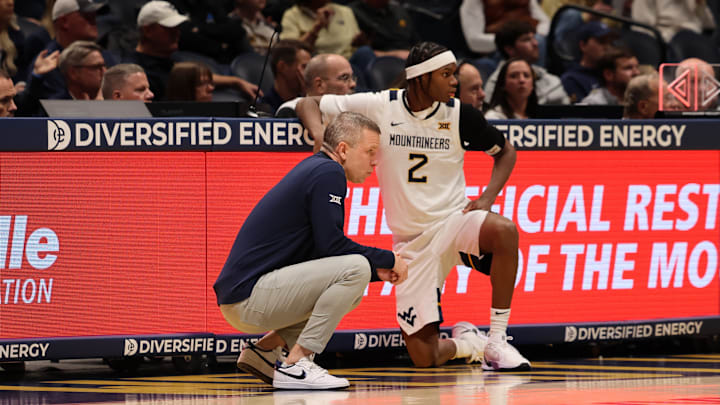West Virginia University head coach Ross Hodge and guard Amir Jenkins West Virginia University head coach Ross Hodge and guard Amir Jenkins