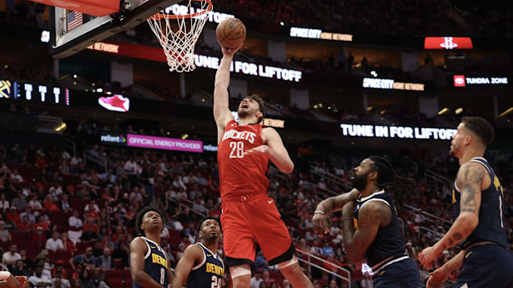 Apr 13, 2025; Houston, Texas, USA;  Houston Rockets center Alperen Sengun (28) dunks against the Denver Nuggets in the second quarter at Toyota Center. Mandatory Credit: Thomas Shea-Imagn Images
