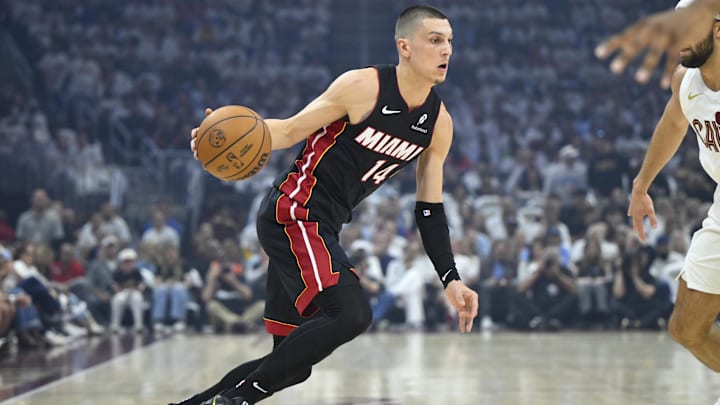Apr 23, 2025; Cleveland, Ohio, USA; Miami Heat guard Tyler Herro (14) dribbles against the Cleveland Cavaliers in the first quarter of game two of the first round of the 2025 NBA Playoffs at Rocket Arena. Mandatory Credit: David Richard-Imagn Images
