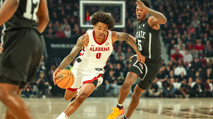 Jan 29, 2025; Starkville, Mississippi, USA; Alabama Crimson Tide guard Labaron Philon (0) drives to the basket against Mississippi State Bulldogs guard Shawn Jones Jr. (5) during the first half at Humphrey Coliseum. Mandatory Credit: Wesley Hale-Imagn Images Jan 29, 2025; Starkville, Mississippi, USA; Alabama Crimson Tide guard Labaron Philon (0) drives to the basket against Mississippi State Bulldogs guard Shawn Jones Jr. (5) during the first half at Humphrey Coliseum. Mandatory Credit: Wesley Hale-Imagn Images