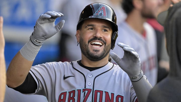 Jul 12, 2025; Anaheim, California, USA;  Arizona Diamondbacks third baseman Eugenio Suarez (28) celebrates in the dugout after his second solo home run of the game during the fourth inning against the Los Angeles Angels at Angel Stadium. Mandatory Credit: Jayne Kamin-Oncea-Imagn Images