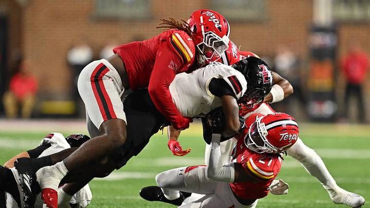 Northern Illinois Huskies wide receiver DeAree Rogers (6) is hauled down in the second half by Maryland Terrapins linebacker Daniel Wingate (1), left and defensive back La'khi Roland (27) at SECU Stadium. Northern Illinois Huskies wide receiver DeAree Rogers (6) is hauled down in the second half by Maryland Terrapins linebacker Daniel Wingate (1), left and defensive back La'khi Roland (27) at SECU Stadium.
