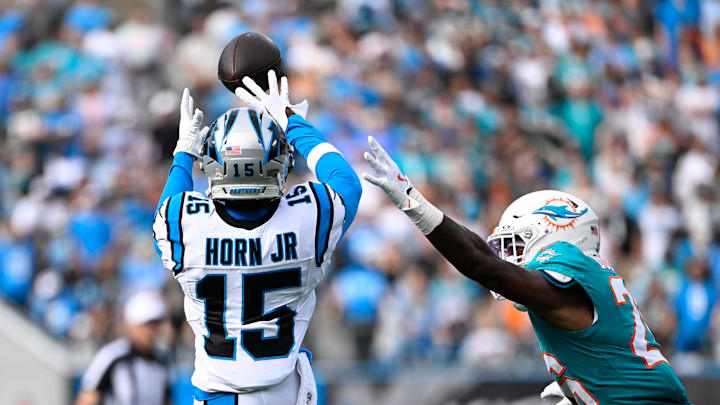 Carolina Panthers wide receiver Jimmy Horn Jr. (15) catches the ball on fourth down as Miami Dolphins cornerback Rasul Douglas (26) defends in the fourth quarter at Bank of America Stadium. Carolina Panthers wide receiver Jimmy Horn Jr. (15) catches the ball on fourth down as Miami Dolphins cornerback Rasul Douglas (26) defends in the fourth quarter at Bank of America Stadium.