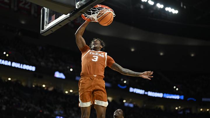 Mar 21, 2026; Portland, OR, USA; Texas Longhorns forward Dailyn Swain (3) dunks against Gonzaga Bulldogs guard Tyon Grant-Foster (7) in the second half during a second round game of the men's 2026 NCAA Tournament at Moda Center. Mandatory Credit: Troy Wayrynen-Imagn Images Mar 21, 2026; Portland, OR, USA; Texas Longhorns forward Dailyn Swain (3) dunks against Gonzaga Bulldogs guard Tyon Grant-Foster (7) in the second half during a second round game of the men's 2026 NCAA Tournament at Moda Center. Mandatory Credit: Troy Wayrynen-Imagn Images