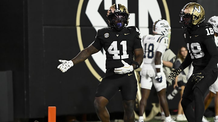 Aug 30, 2025; Nashville, Tennessee, USA;  Vanderbilt Commodores running back Jamezell Lassiter (41) celebrates his touchdown against the Charleston Southern Buccaneers during the second half at FirstBank Stadium. Mandatory Credit: Steve Roberts-Imagn Images