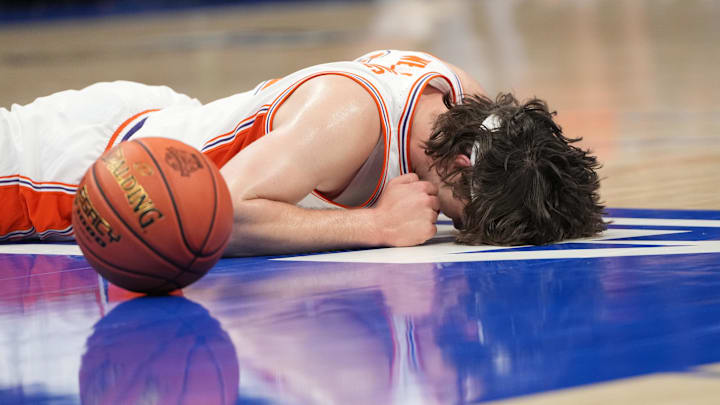 Mar 11, 2026; Charlotte, NC, USA; Clemson Tigers center Carter Welling (22) falls to the floor in the first half at Spectrum Center. Mandatory Credit: Bob Donnan-Imagn Images