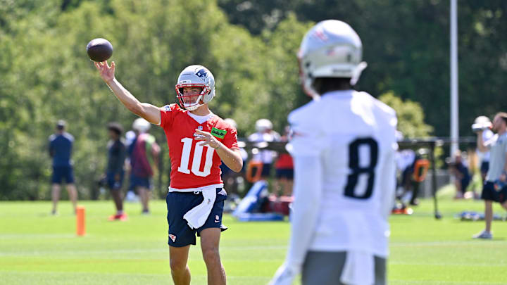 Jul 23, 2025; Foxborough, MA, USA; New England Patriots quarterback Drake Maye (10) throws a pass to wide receiver Stefon Diggs (8) during training camp at Gillette Stadium. Mandatory Credit: Eric Canha-Imagn Images Jul 23, 2025; Foxborough, MA, USA; New England Patriots quarterback Drake Maye (10) throws a pass to wide receiver Stefon Diggs (8) during training camp at Gillette Stadium. Mandatory Credit: Eric Canha-Imagn Images