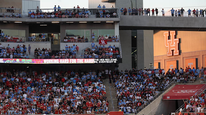Oct 4, 2025; Houston, Texas, USA; Houston Cougars quarterback Conner Weigman (1) rushes against the Texas Tech Raiders in the first half at TDECU Stadium. Mandatory Credit: Thomas Shea-Imagn Images