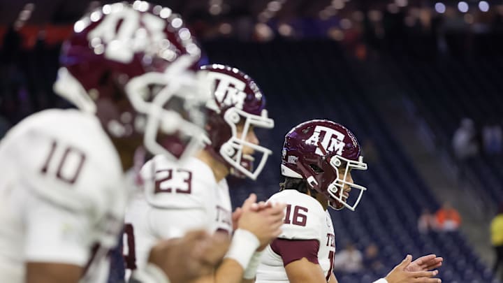 Dec 27, 2023; Houston, TX, USA; From left to right, Texas A&M Aggies quarterbacks Marcel Reed (10), Blake Bost (23), and Jaylen Henderson (16) warm up before playing against the Oklahoma State Cowboys at NRG Stadium. Mandatory Credit: Thomas Shea-USA TODAY Sports
