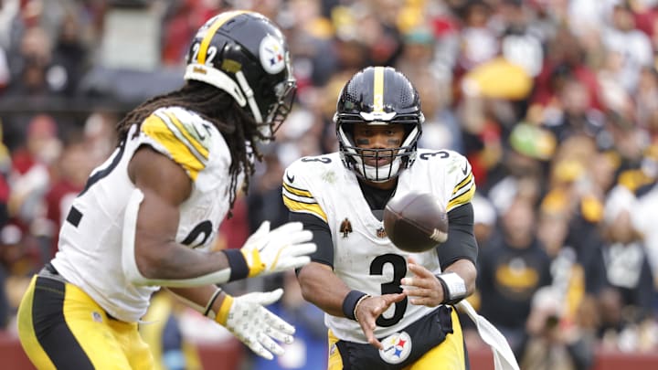 Nov 10, 2024; Landover, Maryland, USA; Pittsburgh Steelers quarterback Russell Wilson (3) tosses the ball to Steelers running back Najee Harris (22) during the second half against the Washington Commanders at Northwest Stadium. Mandatory Credit: Amber Searls-Imagn Images