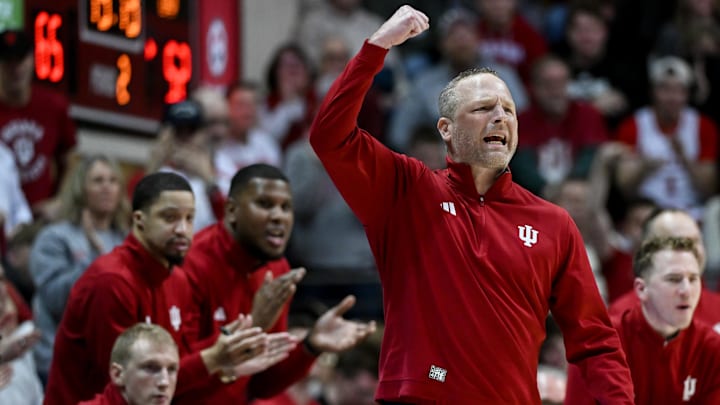 Jan 4, 2026; Bloomington, Indiana, USA; Indiana Hoosiers head coach Darian Devries celebrates after a play against the Washington Huskies during the second half at Simon Skjodt Assembly Hall. Mandatory Credit: Robert Goddin-Imagn Images