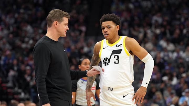 Nov 16, 2024; Sacramento, California, USA; Utah Jazz head coach Will Hardy (left) talks with guard Keyonte George (3) during the third quarter against the Sacramento Kings at Golden 1 Center. Mandatory Credit: Darren Yamashita-Imagn Images