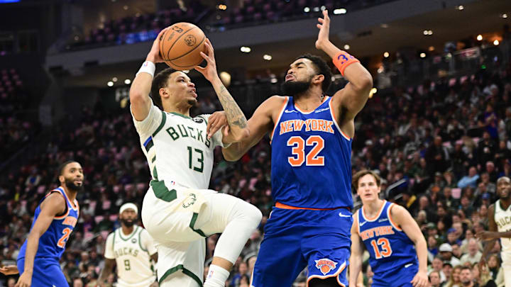 Oct 28, 2025; Milwaukee, Wisconsin, USA; Milwaukee Bucks guard Ryan Rollins (13) takes a shot against New York Knicks center Karl-Anthony Towns (32) in the second quarter at Fiserv Forum. Mandatory Credit: Benny Sieu-Imagn Images Oct 28, 2025; Milwaukee, Wisconsin, USA; Milwaukee Bucks guard Ryan Rollins (13) takes a shot against New York Knicks center Karl-Anthony Towns (32) in the second quarter at Fiserv Forum. Mandatory Credit: Benny Sieu-Imagn Images