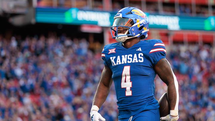 Oct 19, 2024; Kansas City, Missouri, USA; Kansas Jayhawks running back Devin Neal (4) celebrates in the end zone after scoring a touchdown against the Houston Cougars during the fourth quarter at GEHA Field at Arrowhead Stadium. Mandatory Credit: William Purnell-Imagn Images Oct 19, 2024; Kansas City, Missouri, USA; Kansas Jayhawks running back Devin Neal (4) celebrates in the end zone after scoring a touchdown against the Houston Cougars during the fourth quarter at GEHA Field at Arrowhead Stadium. Mandatory Credit: William Purnell-Imagn Images