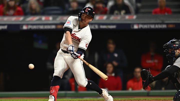 Oct 17, 2024; Cleveland, Ohio, USA; Cleveland Guardians outfielder Will Brennan (17) hits a double during the eighth inning against the New York Yankees in game 3 of the American League Championship Series at Progressive Field. Mandatory Credit: Ken Blaze-Imagn Images