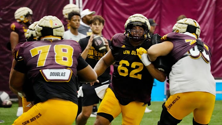 Arizona State offensive lineman Ben Coleman (62) runs a drill during a practice inside the Verde Dickey Dome in Tempe on August 12, 2025.