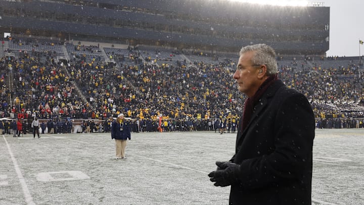 Nov 29, 2025; Ann Arbor, Michigan, USA; Former Ohio State Buckeyes coach Urban Meyer walks the field after the game against the Michigan Wolverines at Michigan Stadium. Mandatory Credit: Rick Osentoski-Imagn Images Nov 29, 2025; Ann Arbor, Michigan, USA; Former Ohio State Buckeyes coach Urban Meyer walks the field after the game against the Michigan Wolverines at Michigan Stadium. Mandatory Credit: Rick Osentoski-Imagn Images