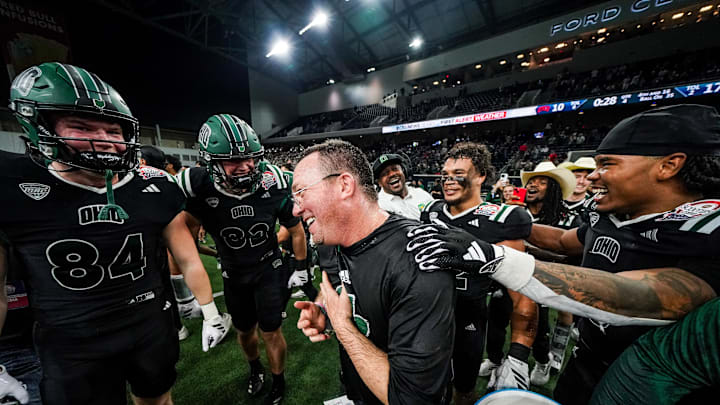 Dec 23, 2025; Frisco, TX, USA;  Ohio Bobcats interim head coach John Hauser is doused with water following a game against the UNLV Rebels at the Ford Center at The Star. Mandatory Credit: Raymond Carlin III-Imagn Images