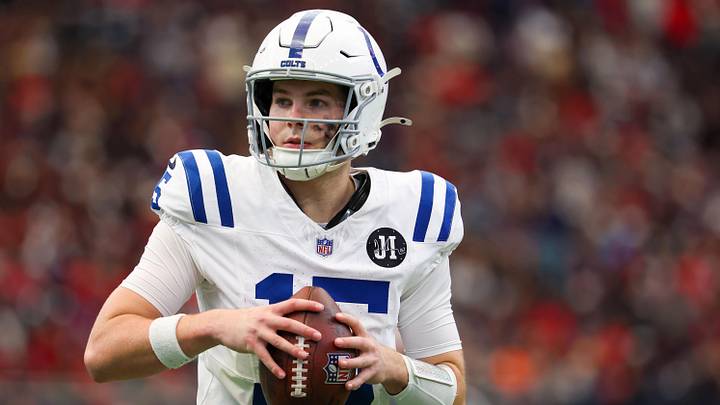 Indianapolis Colts quarterback Riley Leonard (15) warms up on the sidelines before playing against the Houston Texans in the first half at NRG Stadium.