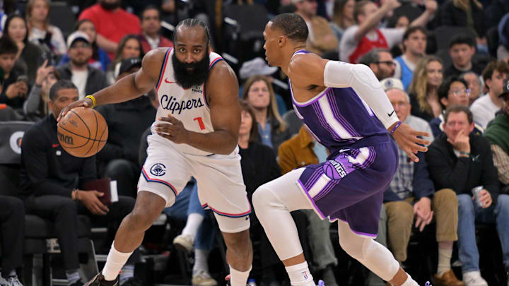 Dec 30, 2025; Inglewood, California, USA;  Sacramento Kings guard Russell Westbrook (18) defends Los Angeles Clippers guard James Harden (1) in the first half at Intuit Dome. Mandatory Credit: Jayne Kamin-Oncea-Imagn Images