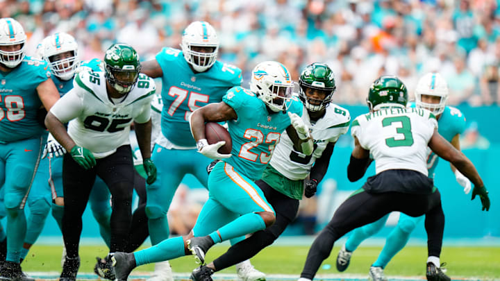 Jan 8, 2023; Miami Gardens, Florida, USA; Miami Dolphins running back Jeff Wilson Jr. (23) runs the