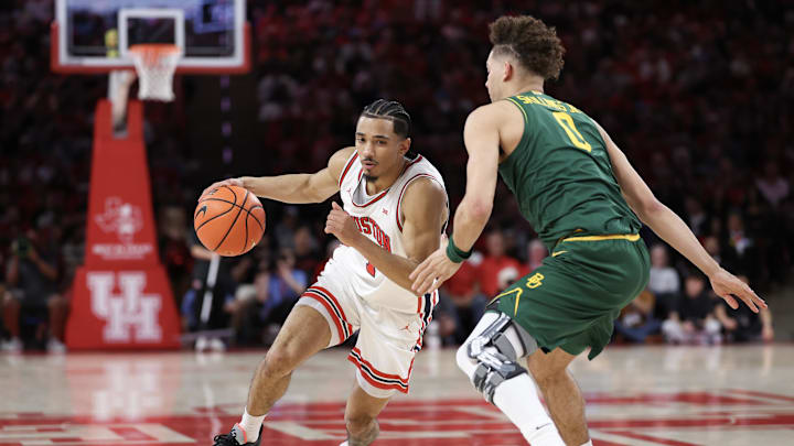Mar 4, 2026; Houston, Texas, USA; Houston Cougars guard Milos Uzan (7) dribbles against Baylor Bears guard Dan Skillings Jr. (0) in the first half at Fertitta Center. Mandatory Credit: Thomas Shea-Imagn Images Mar 4, 2026; Houston, Texas, USA; Houston Cougars guard Milos Uzan (7) dribbles against Baylor Bears guard Dan Skillings Jr. (0) in the first half at Fertitta Center. Mandatory Credit: Thomas Shea-Imagn Images