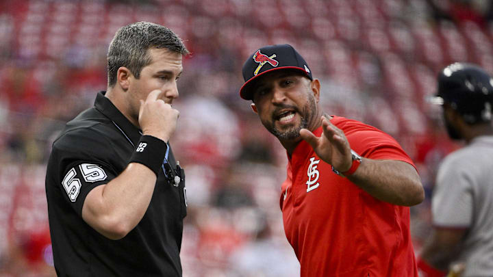 Jul 13, 2025; St. Louis, Missouri, USA;  St. Louis Cardinals manager Oliver Marmol (37) argues with umpire Brennan Miller (55) after he was ejected from the game against the Atlanta Braves during the ninth inning at Busch Stadium. Mandatory Credit: Jeff Curry-Imagn Images