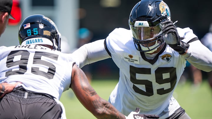 Jacksonville Jaguars defensive end BJ Green II (95) and Jacksonville Jaguars defensive end Myles Cole (59) run drills during the fourth organized team activity at the Miller Electric Center in Jacksonville, Fla. Tuesday, May 27, 2025. [Doug Engle/Florida Times-Union]