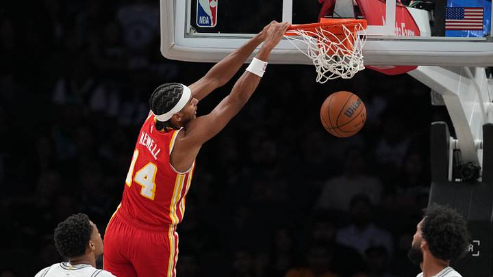Oct 8, 2026; San Antonio, Texas, USA; Atlanta Hawks forward Asa Newell (14) dunks over San Antonio Spurs forwards Keldon Johnson (3) and Julian Champagnie (30) during the first half at Frost Bank Center. Mandatory Credit: Scott Wachter-Imagn Images Oct 8, 2026; San Antonio, Texas, USA; Atlanta Hawks forward Asa Newell (14) dunks over San Antonio Spurs forwards Keldon Johnson (3) and Julian Champagnie (30) during the first half at Frost Bank Center. Mandatory Credit: Scott Wachter-Imagn Images
