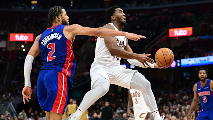 Oct 25, 2024; Cleveland, Ohio, USA; Cleveland Cavaliers guard Donovan Mitchell (45) drives to the basket against Detroit Pistons guard Cade Cunningham (2) during the second half at Rocket Mortgage FieldHouse. Mandatory Credit: Ken Blaze-Imagn Images