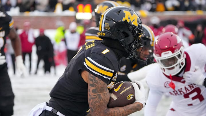 Nov 30, 2024; Columbia, Missouri, USA; Missouri Tigers wide receiver Theo Wease Jr. (1) runs the ball against the Arkansas Razorbacks during the first half at Faurot Field at Memorial Stadium.  