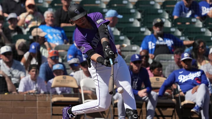 Mar 2, 2026; Salt River Pima-Maricopa, Arizona, USA; Colorado Rockies left fielder Jordan Beck (27) hits against the Los Angeles Dodgers in the first inning at Salt River Fields at Talking Stick. Mandatory Credit: Rick Scuteri-Imagn Images