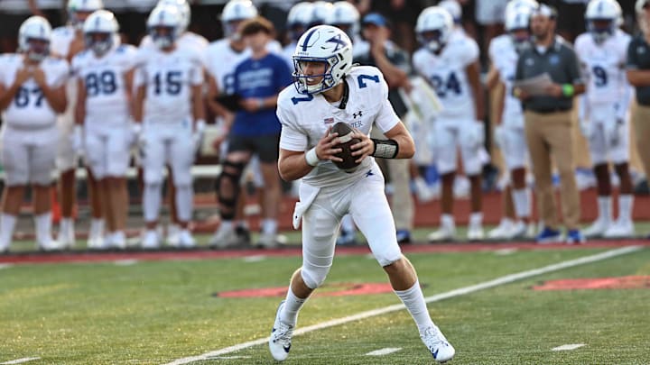 St. Xavier quarterback Chase Herbstreit drops back to pass during the Bombers' football game against Lakota West Friday, Aug. 23, 2024.