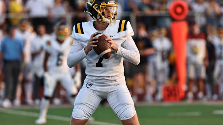 Moeller quarterback Matt Ponatoski drops back to pass during the Crusaders' 38-21 win over Princeton Friday, Aug. 23, 2024.