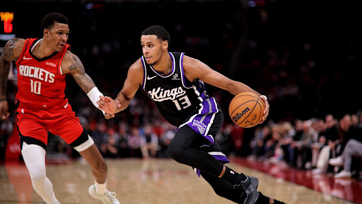 Dec 3, 2025; Houston, Texas, USA; Sacramento Kings forward Keegan Murray (13) drives to the basket against Houston Rockets forward Jabari Smith Jr. (10) during the third quarter at Toyota Center. Mandatory Credit: Erik Williams-Imagn Images