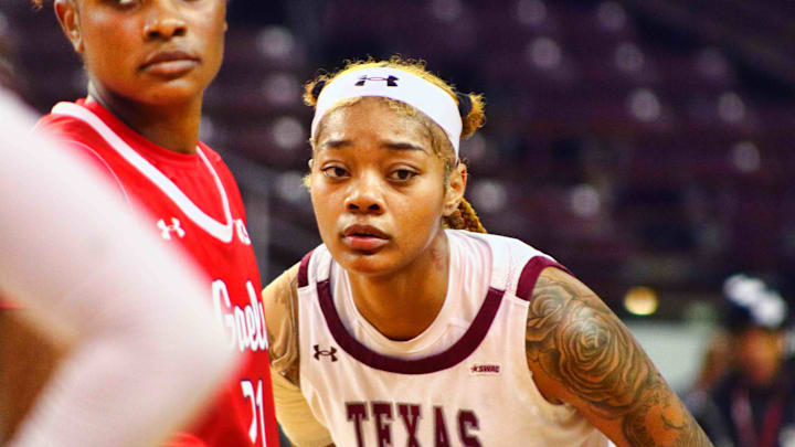 Mar. 20, 2025, Texas Southern Tigers forward Treasure Thompson defending St. Mary's Gaels guard  Kennedy Johnson at the 2025 WNIT basketball game at H&PE Arena in Houston, TX