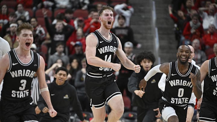 Nov 12, 2022; Louisville, Kentucky, USA;  Wright State Raiders forward Brandon Noel (14) celebrates with teammates after times expires in the second half against the Louisville Cardinals at KFC Yum! Center. Wright State defeated Louisville 73-72. Mandatory Credit: Jamie Rhodes-Imagn Images