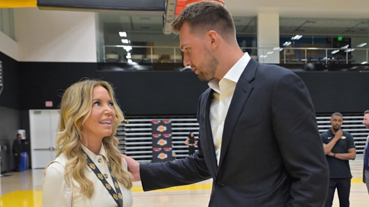 Aug 2, 2025; El Segundo, CA, USA; Los Angeles Lakers Luka Doncic (77) talks with team co-owner Jeanie Buss following a press conference announcing the signing of a 3-year, $165 million contract extension at UCLA Health Training Center. Mandatory Credit: Jayne Kamin-Oncea-Imagn Images