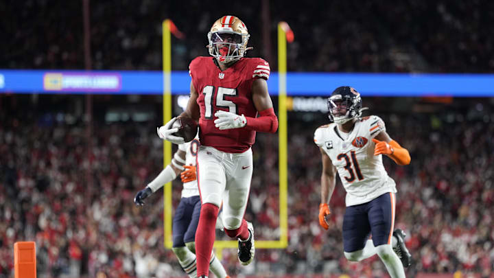 Dec 28, 2025; Santa Clara, California, USA; San Francisco 49ers wide receiver Jauan Jennings (15) runs to score a touchdown against the Chicago Bears in the second half at Levi's Stadium. Mandatory Credit: Kyle Terada-Imagn Images