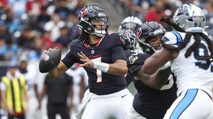 Aug 16, 2025; Houston, Texas, USA; Houston Texans quarterback C.J. Stroud (7) attempts a pass during the first quarter against the Carolina Panthers at NRG Stadium. Mandatory Credit: Troy Taormina-Imagn Images