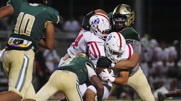 Basha defensive tackle Tevita (David) Kale (55) makes a tackle on Millard South runningback Gabe Prucha (8) during a game at Hamilton High School in Chandler on Aug. 30, 2024.