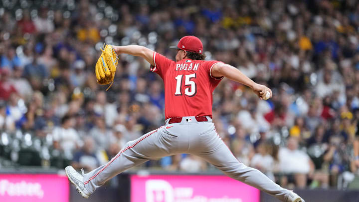 Sep 27, 2025; Milwaukee, Wisconsin, USA;  Cincinnati Reds pitcher Emilio Pagan (15) throws a pitch during the ninth inning against the Milwaukee Brewers at American Family Field. Mandatory Credit: Jeff Hanisch-Imagn Images