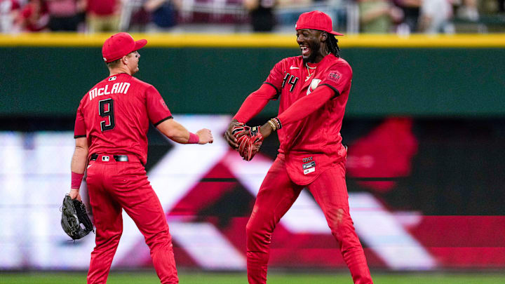 Cincinnati Reds second baseman Matt McLain (9) and shortstop Elly de la Cruz (44) celebrate a win after the ninth inning of the MLB Interleague game between the Cincinnati Reds and the Detroit Tigers at Great American Ball Park in downtown Cincinnati on Saturday, April 25, 2026. The Reds won the second game of the series, 9-2.