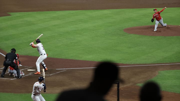 Fans watch as Los Angeles Angels starting pitcher Jose Suarez (54) pitches against Houston Astros right fielder Kyle Tucker (30) in the first inning at Minute Maid Park in 2024.
