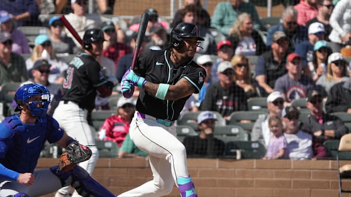 Mar 3, 2025; Salt River Pima-Maricopa, Arizona, USA; Arizona Diamondbacks second base Ketel Marte (4) hits a single against the Chicago Cubs in the first inning at Salt River Fields at Talking Stick. Mandatory Credit: Rick Scuteri-Imagn Images