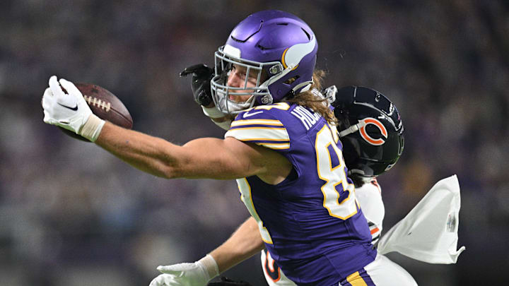 Nov 27, 2023; Minneapolis, Minnesota, USA; Minnesota Vikings tight end T.J. Hockenson (87) drops a pass during the second quarter as Chicago Bears cornerback Kyler Gordon (6) defends at U.S. Bank Stadium. Mandatory Credit: Jeffrey Becker-Imagn Images