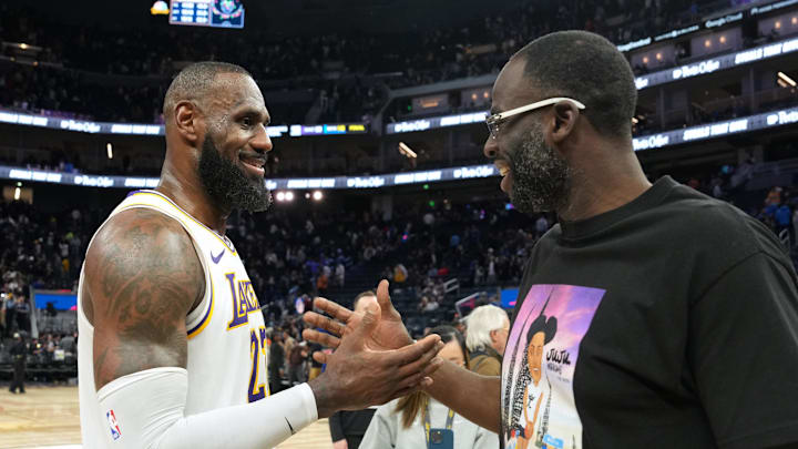 Jan 25, 2025; San Francisco, California, USA; Los Angeles Lakers forward LeBron James (left) talks with Golden State Warriors forward Draymond Green (right) after the game at Chase Center. Mandatory Credit: Darren Yamashita-Imagn Images