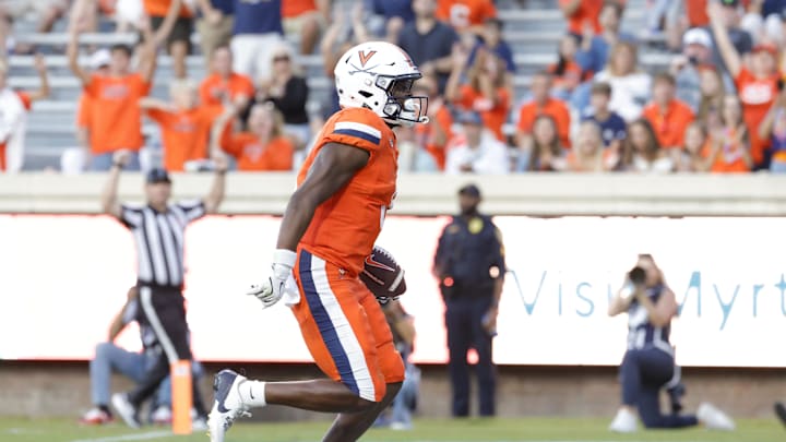 Aug 30, 2025; Charlottesville, Virginia, USA; Virginia Cavaliers wide receiver Cam Ross (6) scores a touchdown against the Coastal Carolina Chanticleers during the second quarter at Scott Stadium. Mandatory Credit: Amber Searls-Imagn Images