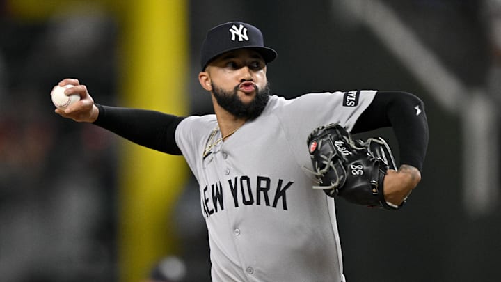 Aug 4, 2025; Arlington, Texas, USA; New York Yankees relief pitcher Devin Williams (38) pitches against the Texas Rangers during the ninth inning at Globe Life Field. Mandatory Credit: Jerome Miron-Imagn Images