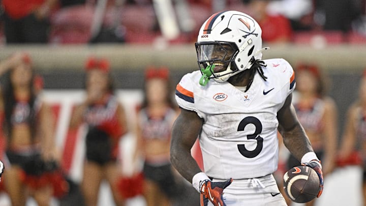 Oct 4, 2025; Louisville, Kentucky, USA; Virginia Cavaliers running back J'Mari Taylor (3) celebrates a touchdown during overtime against the Louisville Cardinals at L&N Federal Credit Union Stadium. Virginia defeated Louisville 30-27. Mandatory Credit: Jamie Rhodes-Imagn Images